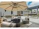An outdoor patio showcases ample seating around a fire pit, offering a relaxing and comfortable gathering space at 2711 Bluffton Rd, Buford, GA 30519