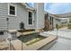 This beautiful home features a backyard water feature and landscaped yard with an elegant patio area at 2711 Bluffton Rd, Buford, GA 30519