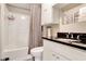 A bathroom with a black countertop, vanity and shower and bathtub combo at 3337 Camens Way, Buford, GA 30519