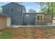 Back exterior with a wooden deck, shed, and a concrete patio at 4339 Rushmore Pl, Forest Park, GA 30297