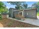 Back exterior with a wooden deck, shed, and a concrete patio at 4339 Rushmore Pl, Forest Park, GA 30297