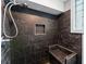Bathroom with marble tile, shower stall, a built-in bench, and natural light at 4339 Rushmore Pl, Forest Park, GA 30297