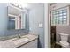 Updated bathroom with granite countertop, modern fixtures, glass block window and a shower with a seat at 4339 Rushmore Pl, Forest Park, GA 30297