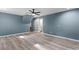 Bedroom featuring gray walls, wood flooring, a ceiling fan, and natural light at 4339 Rushmore Pl, Forest Park, GA 30297