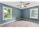 Bedroom with two windows providing ample natural light and hardwood floors throughout at 4339 Rushmore Pl, Forest Park, GA 30297