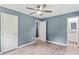Bedroom features painted walls, wood floors, two doors and a ceiling fan at 4339 Rushmore Pl, Forest Park, GA 30297