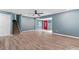 Spacious living room with wood flooring, recessed lighting, and a staircase at 4339 Rushmore Pl, Forest Park, GA 30297