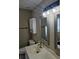 Well lit bathroom with a modern vanity, decorative mirrors, and modern lighting fixtures at 4845 Weathervane Dr, Alpharetta, GA 30022