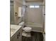 Bathroom featuring tiled walls, a marble vanity, and modern fixtures at 4845 Weathervane Dr, Alpharetta, GA 30022