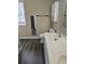 Bright bathroom featuring a modern vanity with dual sinks and updated fixtures at 4845 Weathervane Dr, Alpharetta, GA 30022