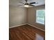 Bedroom featuring hardwood floors, a ceiling fan, and natural light at 4845 Weathervane Dr, Alpharetta, GA 30022