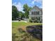 Lovely two-story home with a lush green lawn and tasteful landscaping at 4845 Weathervane Dr, Alpharetta, GA 30022
