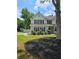 Classic two-story home with a well-manicured front yard and charming curb appeal at 4845 Weathervane Dr, Alpharetta, GA 30022