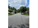 A quiet suburban street with well-kept lawns and various home styles at 4845 Weathervane Dr, Alpharetta, GA 30022