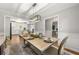 Dining area with wood table, stylish chairs, and a view into the kitchen and office at 1444 Arden Sw Dr, Marietta, GA 30008