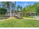 Charming single-story home with a welcoming front porch, lush lawn, and convenient carport in a tranquil setting at 1444 Arden Sw Dr, Marietta, GA 30008