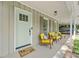 Inviting front porch with seating, a stylish door, and a 'wipe your paws' welcome mat at 1444 Arden Sw Dr, Marietta, GA 30008