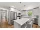 Updated kitchen featuring stainless steel appliances, an island with seating, and bright countertops at 1444 Arden Sw Dr, Marietta, GA 30008