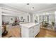 Bright, open kitchen island overlooking the living and dining spaces with modern finishes at 1444 Arden Sw Dr, Marietta, GA 30008