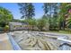 This backyard features a swimming pool ready for renovation to provide outdoor enjoyment at 1444 Arden Sw Dr, Marietta, GA 30008
