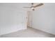 This bedroom has plush carpet, a ceiling fan, and two entry doors at 1721 Druids Se Xing, Conyers, GA 30013