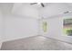 Large bedroom with ceiling fan, high ceilings, and two windows at 1721 Druids Se Xing, Conyers, GA 30013