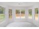 Bright breakfast nook surrounded by windows with views of the outdoor deck at 1721 Druids Se Xing, Conyers, GA 30013