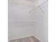 Spacious walk-in closet with carpet and wire shelving for organized storage solutions at 1721 Druids Se Xing, Conyers, GA 30013