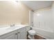 Bathroom with white vanity, toilet, and tub-shower combo at 5718 Hidden Brook Cir, Atlanta, GA 30349