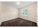 Bedroom featuring neutral walls, window, and carpeting at 5718 Hidden Brook Cir, Atlanta, GA 30349