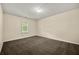 Bedroom with neutral walls, carpet, and natural light at 5718 Hidden Brook Cir, Atlanta, GA 30349
