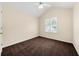 This bedroom has neutral walls, a ceiling fan and a bright window at 5718 Hidden Brook Cir, Atlanta, GA 30349
