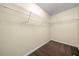 Walk-in closet with built-in shelving and carpeted floor at 5718 Hidden Brook Cir, Atlanta, GA 30349
