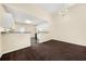 Kitchen area featuring white cabinets and open access to the dining area at 5718 Hidden Brook Cir, Atlanta, GA 30349