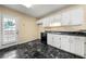 Functional kitchen features ample cabinet space and a door to the back yard at 5718 Hidden Brook Cir, Atlanta, GA 30349