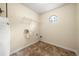Laundry room with a window and a utility sink at 5718 Hidden Brook Cir, Atlanta, GA 30349