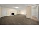 Spacious living room with a fireplace and neutral carpet at 5718 Hidden Brook Cir, Atlanta, GA 30349