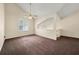Bright living room features vaulted ceilings, a ceiling fan and large windows at 5718 Hidden Brook Cir, Atlanta, GA 30349