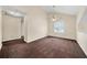 Spacious living room with vaulted ceilings, ceiling fan, and bright windows at 5718 Hidden Brook Cir, Atlanta, GA 30349
