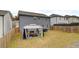 Backyard featuring a well-maintained lawn and a stylish gazebo, perfect for outdoor relaxation and entertainment at 7246 Gladstone Cir, Lithonia, GA 30038