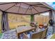 Close up of backyard canopy with seating, a patio, and outdoor decor, inviting backyard atmosphere for gathering at 7246 Gladstone Cir, Lithonia, GA 30038