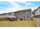 Spacious backyard with an outdoor canopy, grill and green space, perfect for outdoor activities and relaxation at 7246 Gladstone Cir, Lithonia, GA 30038