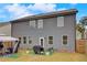 Backyard patio with patio furniture under a canopy, grill, and lots of natural light at 7246 Gladstone Cir, Lithonia, GA 30038