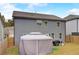 Exterior of home showing fenced backyard with a patio area under a gazebo-style shelter and lush green grass at 7246 Gladstone Cir, Lithonia, GA 30038