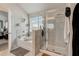 Spacious bathroom featuring separate shower, soaking tub, and large window with backyard view at 7246 Gladstone Cir, Lithonia, GA 30038