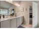Inviting bathroom featuring double sinks, generous vanity space, and light tile flooring at 7246 Gladstone Cir, Lithonia, GA 30038
