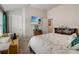 Bright bedroom featuring a yellow sofa, mounted TV, and neutral walls at 7246 Gladstone Cir, Lithonia, GA 30038