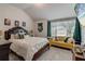 Bright bedroom with a mounted TV, large window, and decorative pillows at 7246 Gladstone Cir, Lithonia, GA 30038