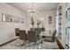Modern dining room featuring a glass table with seating for six and stylish decor at 7246 Gladstone Cir, Lithonia, GA 30038