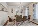 Elegant dining room with modern decor, including a glass table and stylish accents at 7246 Gladstone Cir, Lithonia, GA 30038